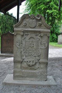 Gloves are displayed on the stone of Andrew Kippen who died in 1761; the buckle and shears are also tools of the trade as a glover.