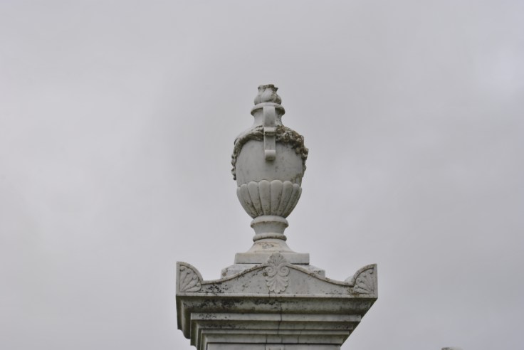 white urn grave grey sky