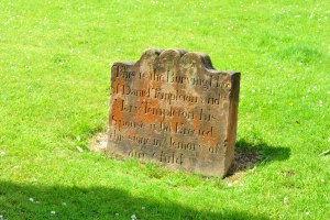 lichen coloured gravestone