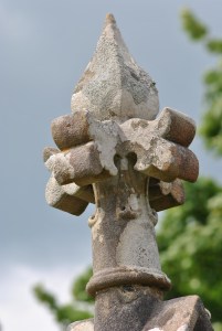 elaborately carved stone head on mausoleum